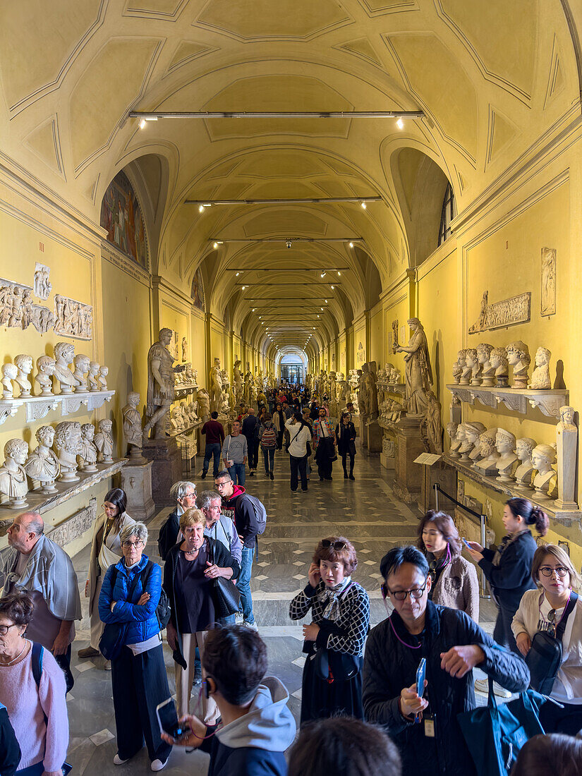 Tourists in the Chiaramonti Museum in the Vatican Museums, Vatican City, Rome, Italy.