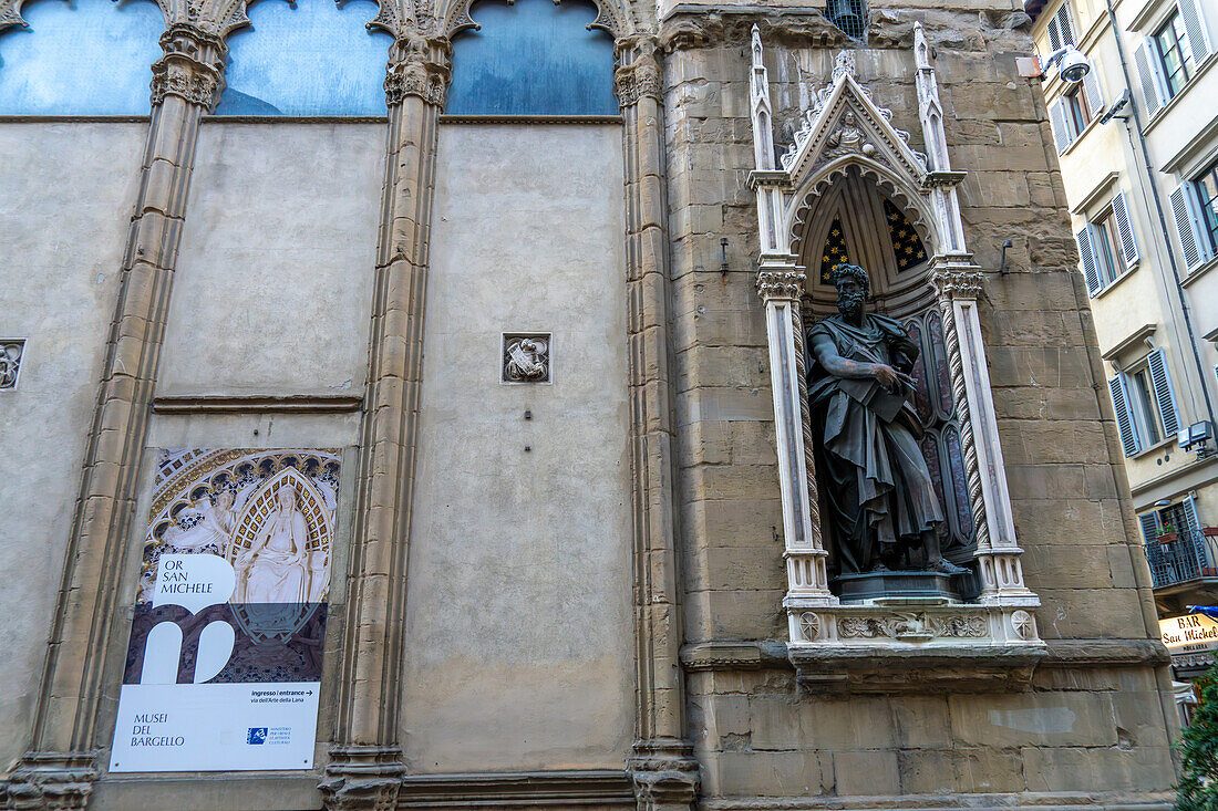 Statue of St. Luke on the Orasanmichele Church in Florence, Italy. St. Luke was the patron saint of the magistrates & notaries guild. The statue was created by Giambologna in 1601 A.D.