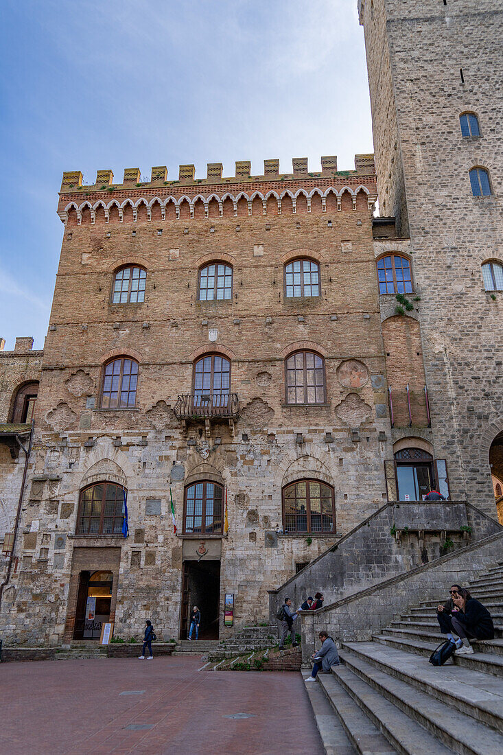 Facade of the 13th Century Palazzo Comunale, Palazzo del Popolo or city hall in San Gimignano, Italy.