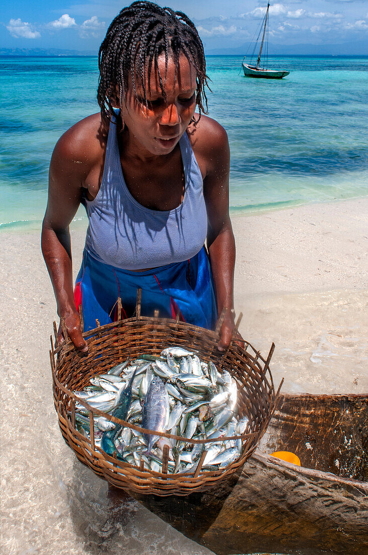 Fishermen with the catch of the day in Cayes-à-L’eau, a fishermen islet located northeast of Caye Grand Gosie, Île-à-Vache, Sud Province, Haiti