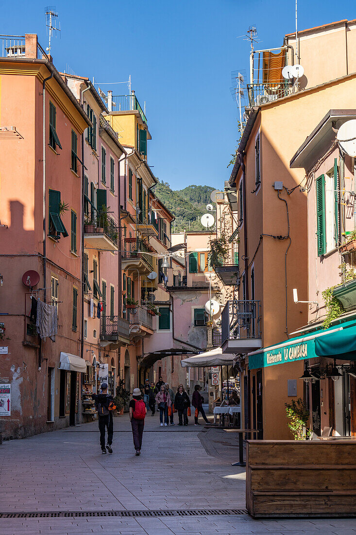 Tourists on Via Roma in the old town section of Monterosso al Mare, Cinque Terre, Italy.