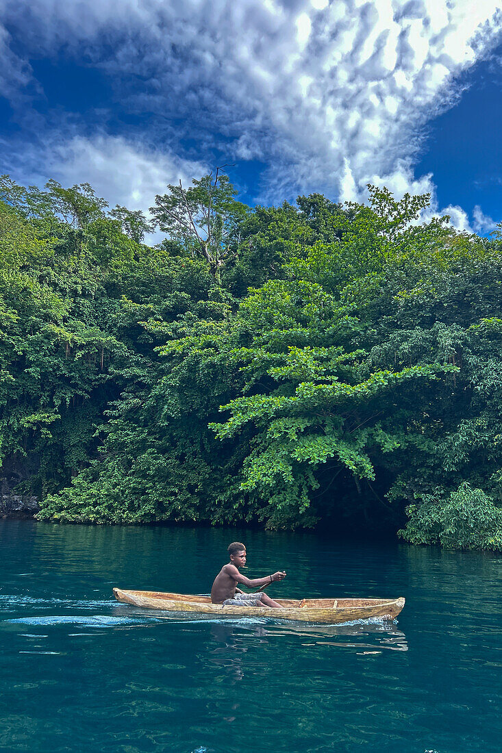 Residents of Vitu Islands in their traditional dugout canoes, Garove Island, Johann Albrecht Harbour, Papua New Guinea