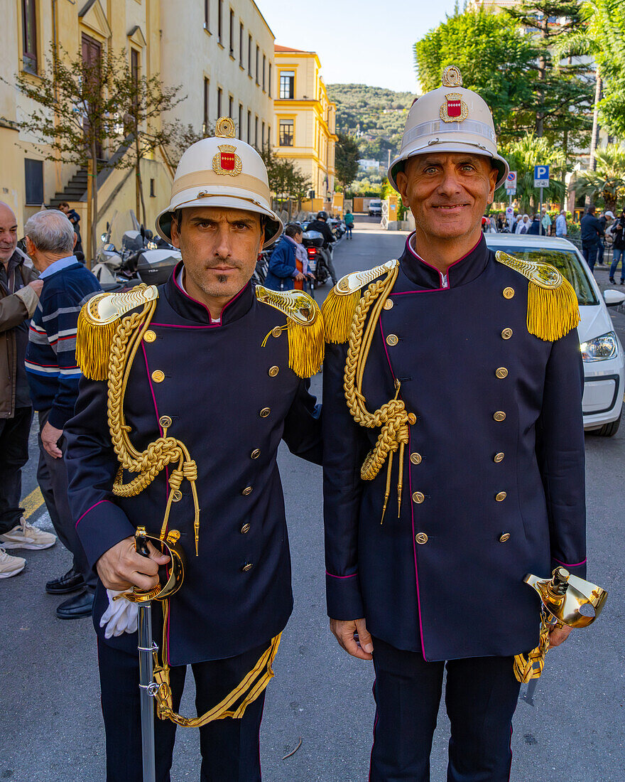 Two Italian policemen in dress uniforms after a war memorial ceremony in Sorrento, Italy.