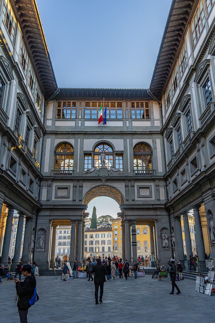 A view of tourists in the cortile or internal courtyard of the Uffizi Gallery in Florence, Italy.