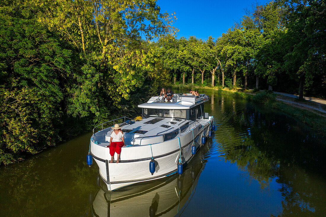 Aerial view of a nice landscape in the Canal du Midi near L'écluse de Marseillette South of France southern waterway waterways holidaymakers queue for a boat trip on the river, France, Europe