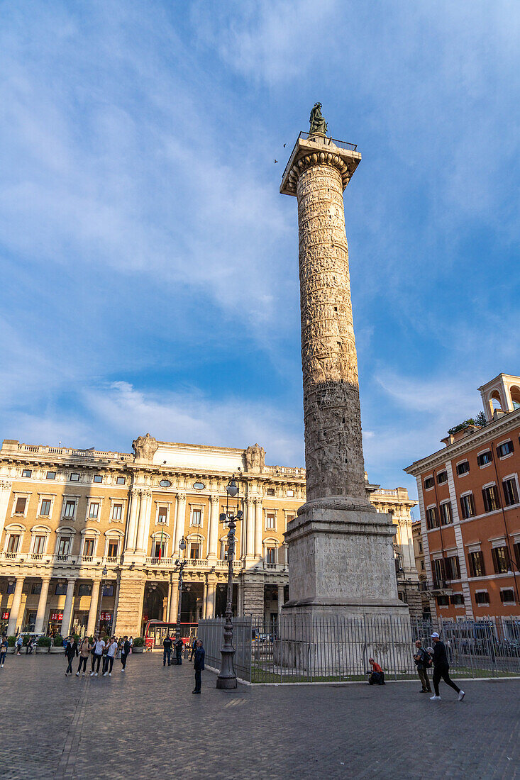 Column of Marcus Aurelius topped by a bronze statue of St. Paul in the Piazza Colonna in Rome, Italy.