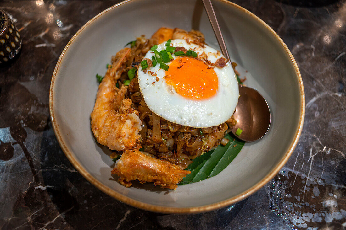 Asian food in the restaruant of the The Ritz-Carlton Langkawi luxury hotel in Langkawi, Malaysia.