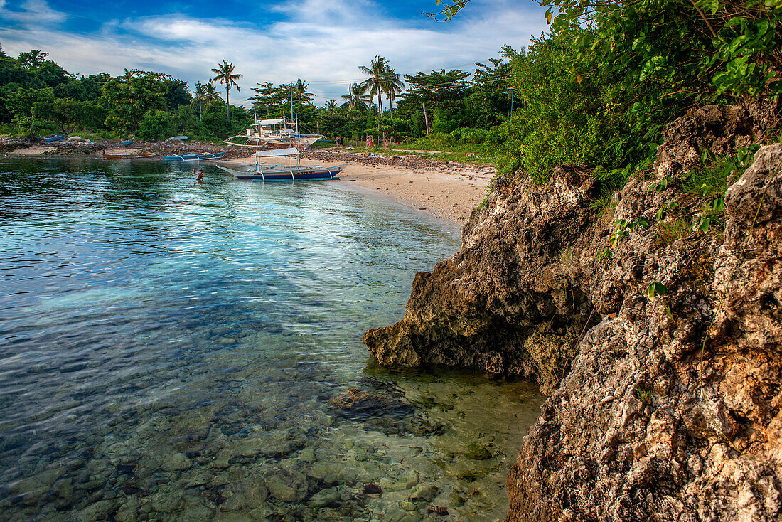 Traditional boats moored in Logon beach, Malapascua island, Cebu, Philippines