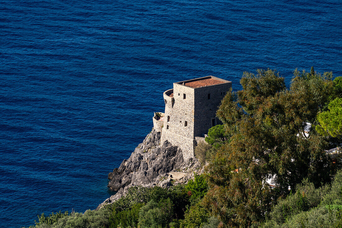 A medieval Saracen watch tower on the a headland on the Amalfi Coast at Praiano, Italy.