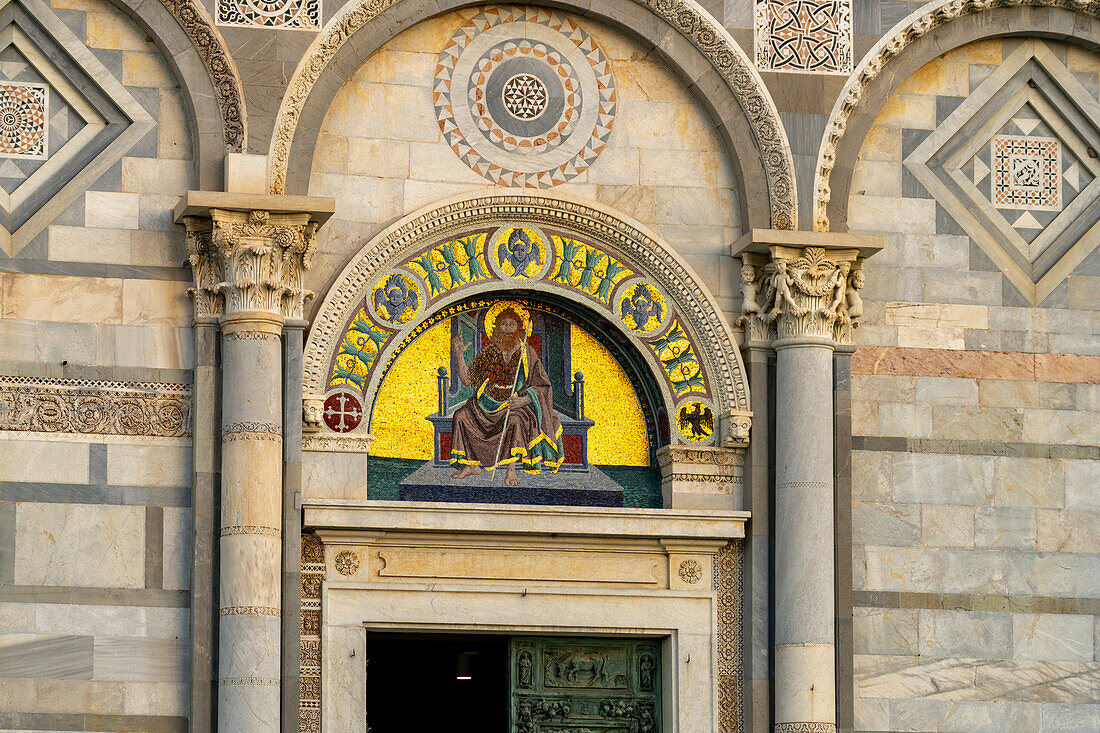 Gold mosaic depicting John the Baptist over the right portal of the west facade of the Duomo of Pisa. Pisa, Italy. Created by Giuseppe Modena da Lucca.