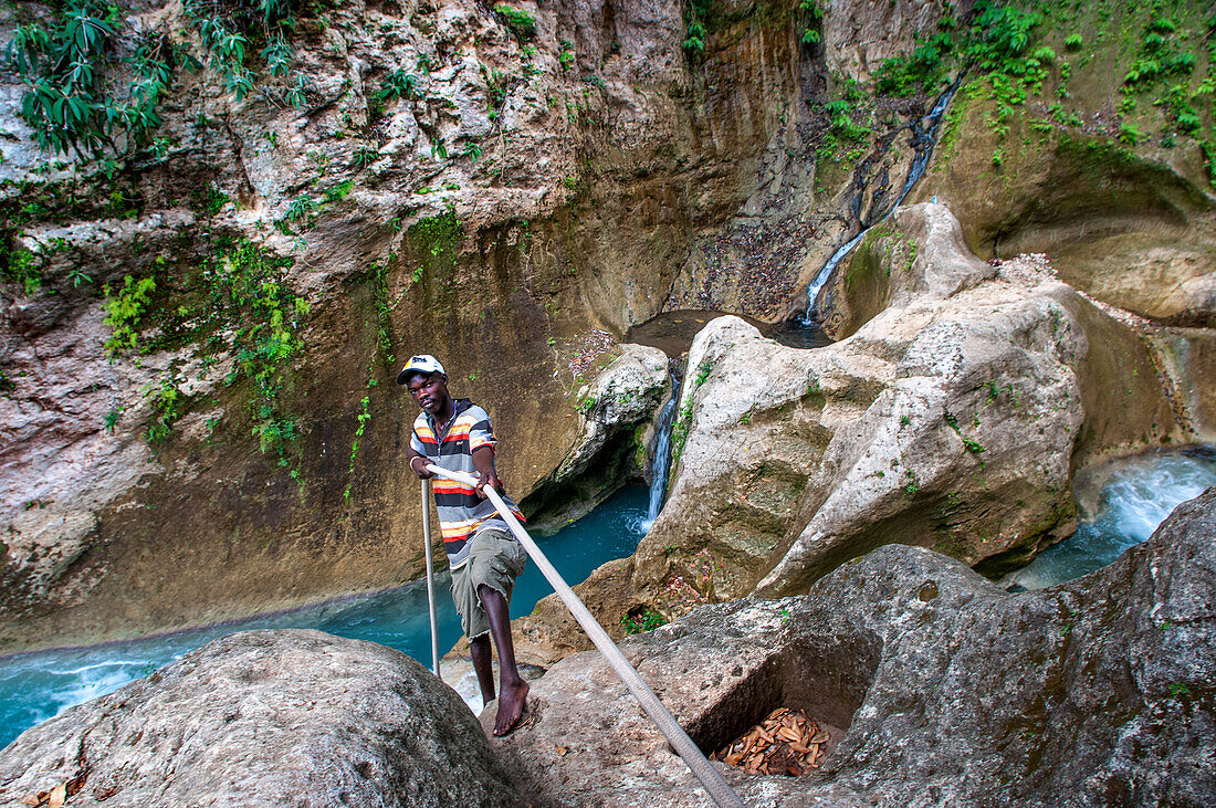 Exploring the cobalt waters of Bassin Bleu waterfall composed of bassin yes, bassin palmiste and bassin clair, Maire de Jacmel, Jacmel, Haiti