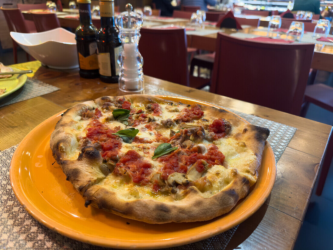 A typical Italian-style pizza in a restaurant / pizzeria in Sorrento, Italy.