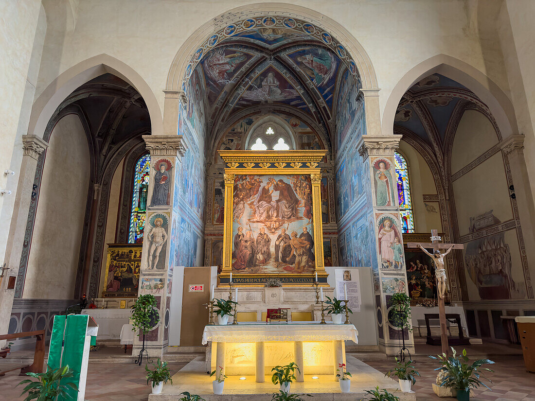 The altar and main altarpiece of the Church of Sant'Agostino, Gimignano, Italy. Entitled Coronation of the VIrgin by Piero del Pollaiuolo, painted in 1483 A.D.