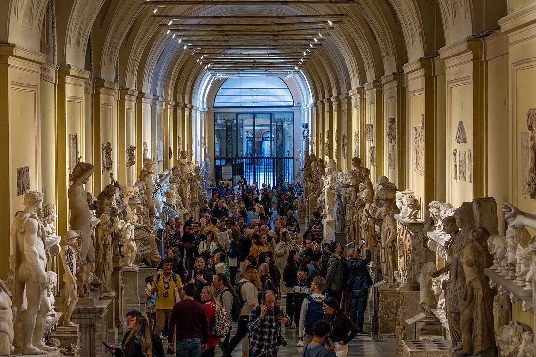 Tourists in the Chiaramonti Museum in the Vatican Museums, Vatican City, Rome, Italy.