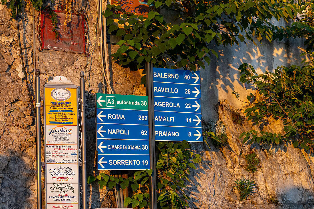 Roadsigns on SS163, the Amalfi Coast road, in the town of Positano, Italy.