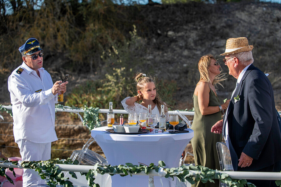 Wedding on the deck of a ship. Canal du Midi at Le Somail Aude South of France southern waterway waterways holidaymakers queue for a boat trip on the river, France, Europe