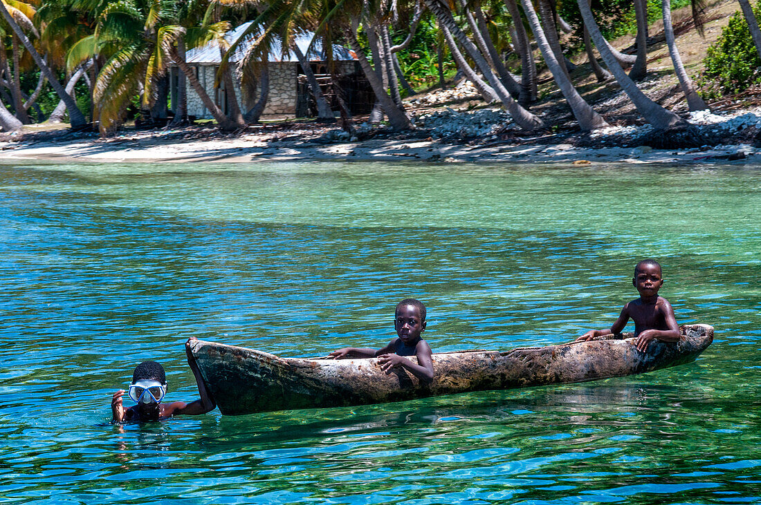 Fishermen in the waterfront beach in Île-à-Vache, Sud Province, Haiti