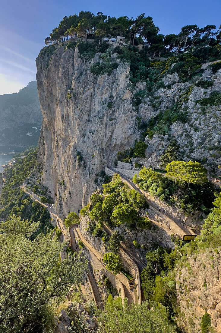 Tourists on the Via Krupp switchback trail down the cliffs from Capri to Marina Piccola on Capri, Italy.