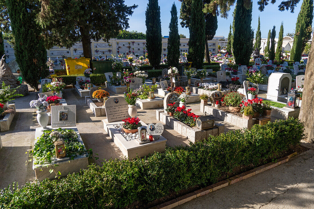 Flowers on the graves in a cemetery in Anacapri on the island of Capri, Italy.