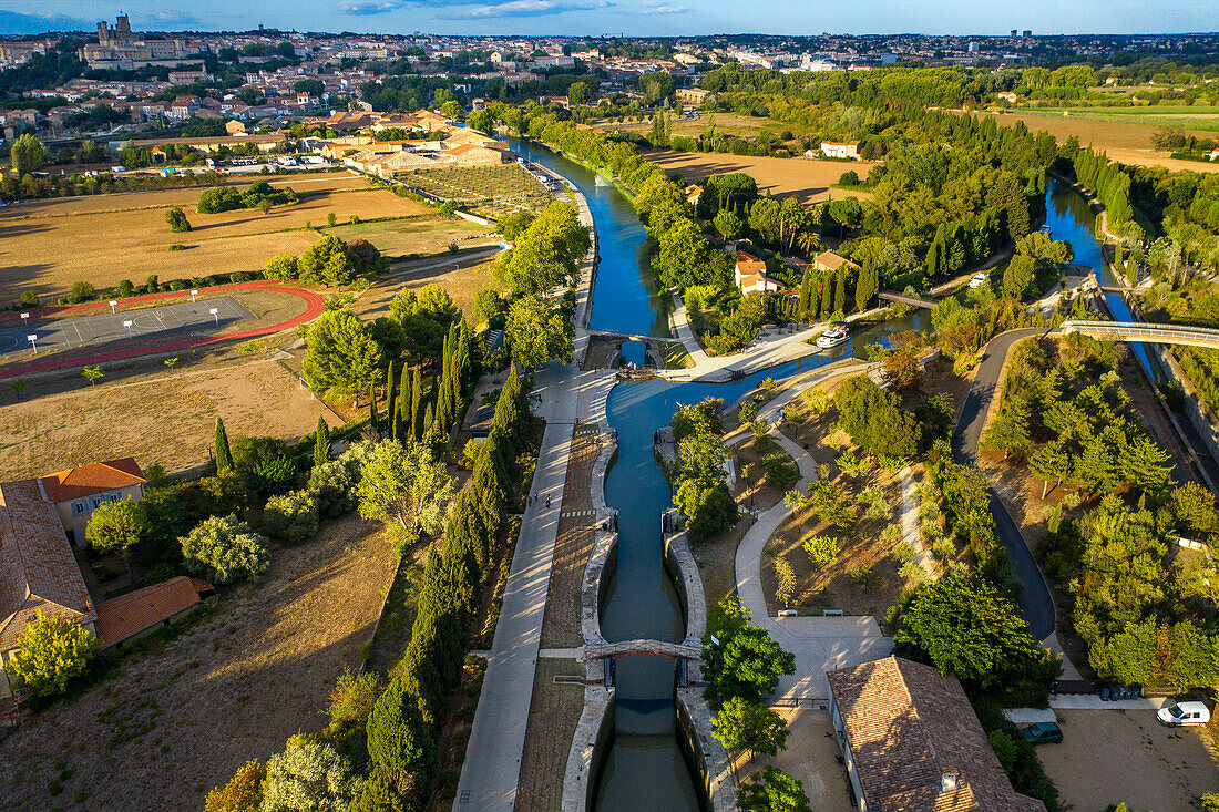 Aerial view of the 9 éscluses of Fonseranes looks, Beziers. Canal du Midi at Fonseranes, Beziers Aude South of France southern waterway waterways holidaymakers queue for a boat trip on the river, France, Europe