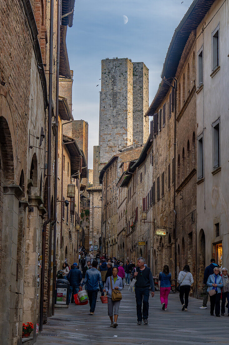 The twin Salvucci Towers and the Via San Matteo in the medieval city of San Gimignano, in Tuscany, Italy.