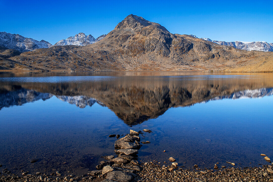 Mountain reflection in the lake in the flower valley in Tasiilaq, also known as Ammassalik, East Greenland, Greenland