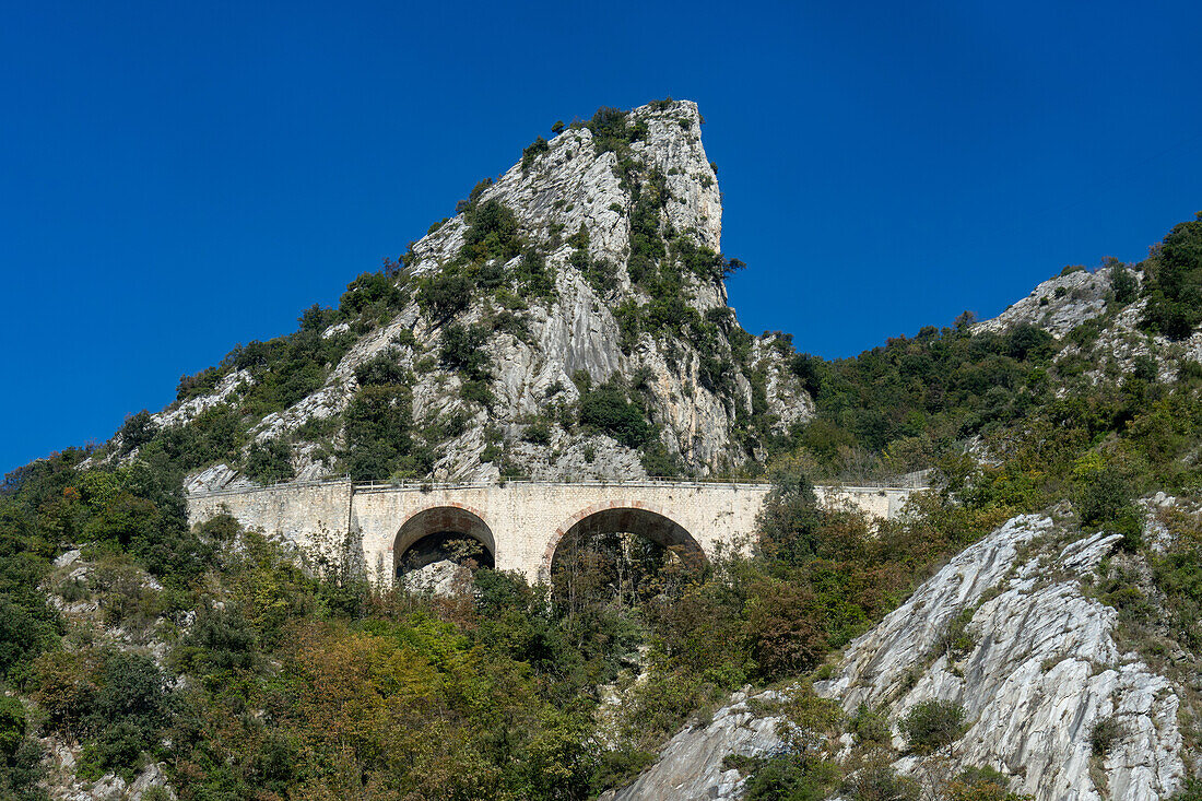 A stone road viaduct in the Torano Valley near the marble quarries of Carrara, Italy.