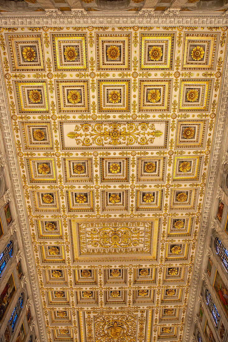 The ornate ceiling of the central nave of the Basilica of St. Paul Outside the Walls, Rome, Italy.