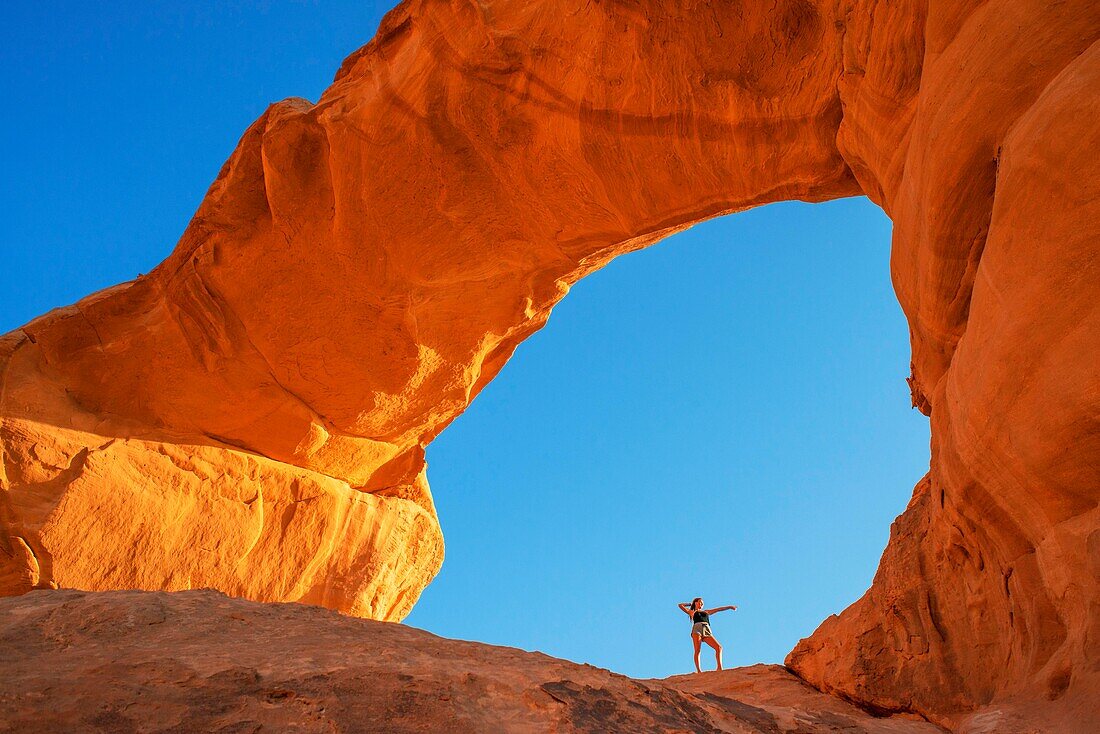 Hiking at rock-arch Al Kharza or Al Borg Alsagheer Wadi Rum, Jordan