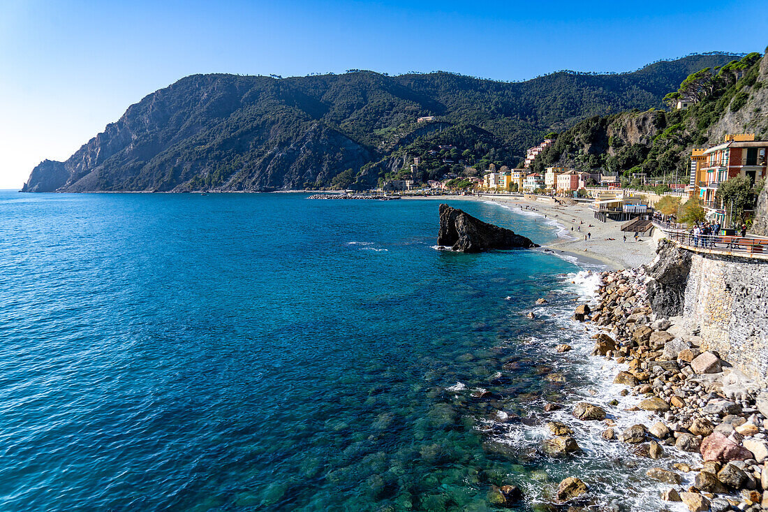 The Fegina beach in off peak season in Monterosso al Mare, Cinque Terre, Italy, with the Scoglio Malpasso or Malpasso Rock.