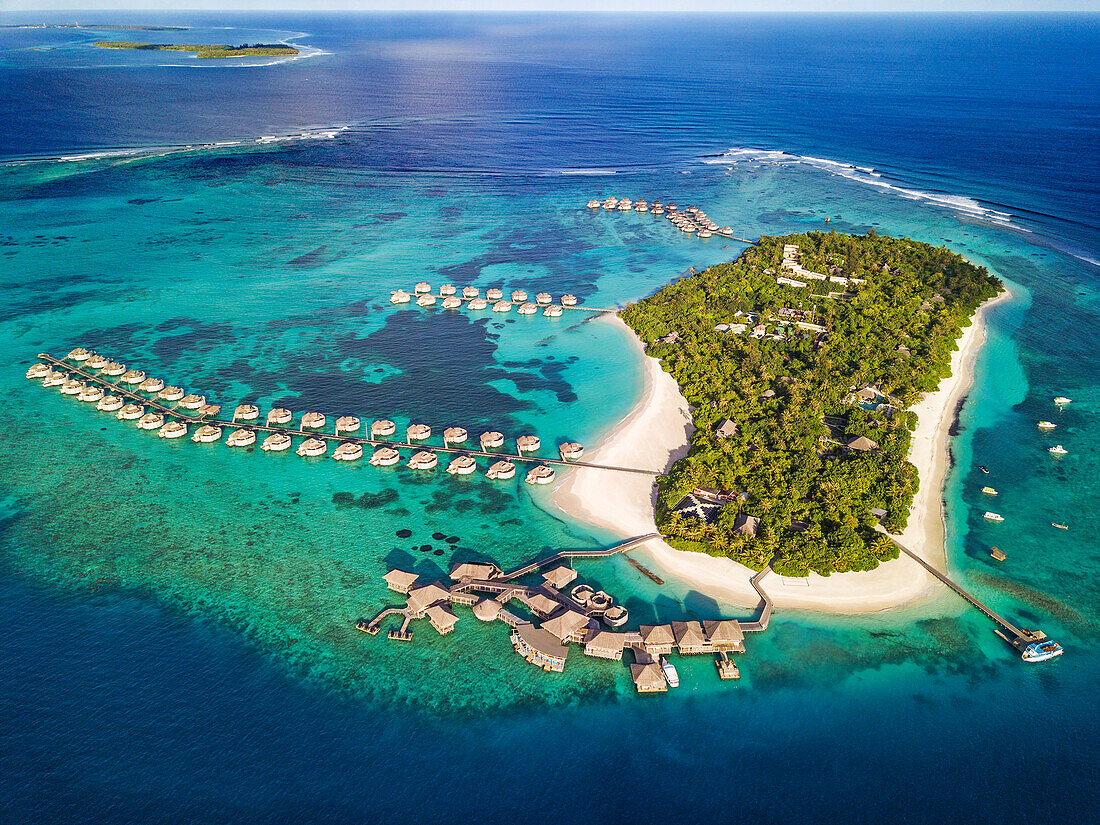 Aerial view of the luxury ower water villas of Six Senses Laamu maldives luxury resort villas, Laamu Atoll region Maldives