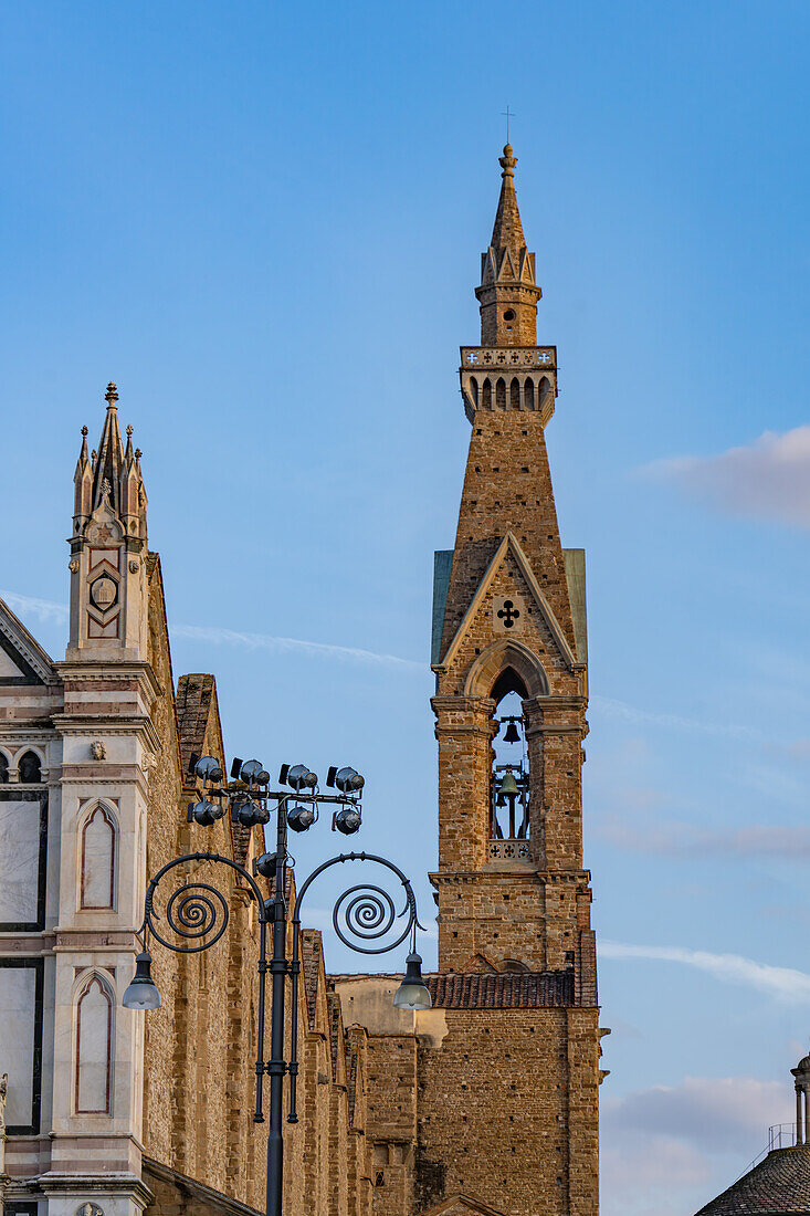 The campanile or bell tower of the Basilica of Santa Croce or Basilica of the Holy Cross in Florence, Italy.