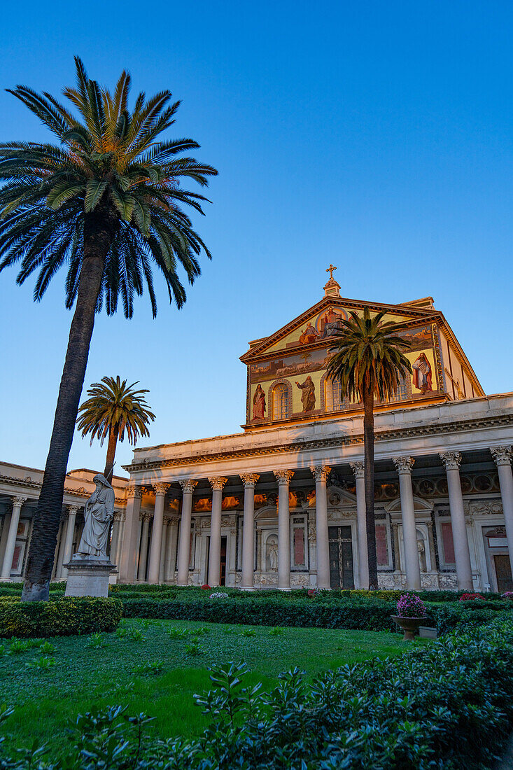 The statue of St. Paul and facade of the Basilica of St. Paul Outside the Walls, Rome, Italy.