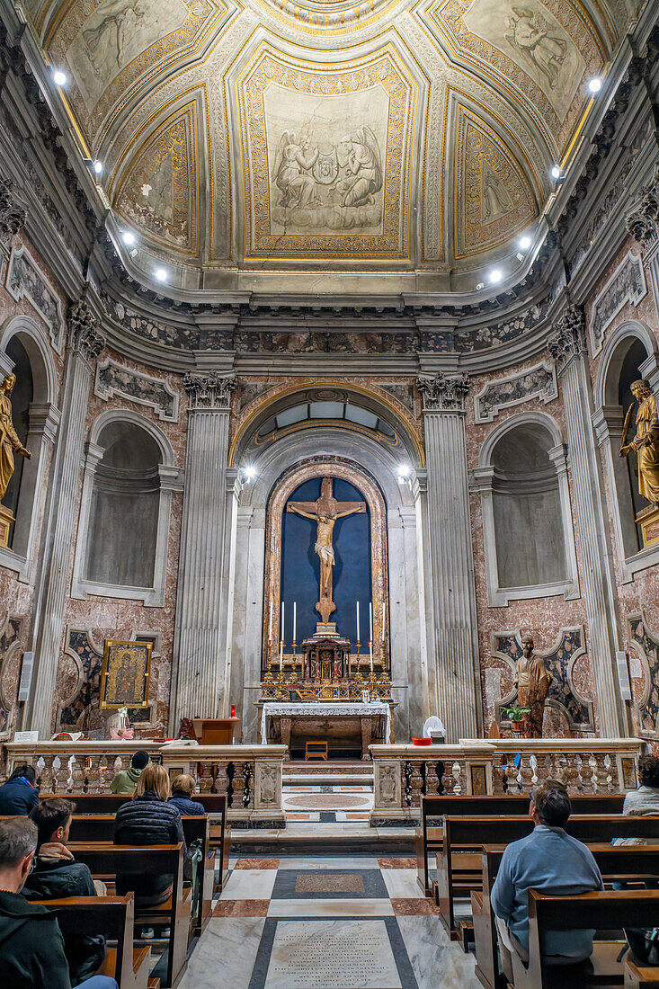 Worshippers in the Chapel of the Blessed Sacrament in the Basilica of St. Paul Outside the Walls, Rome, Italy.