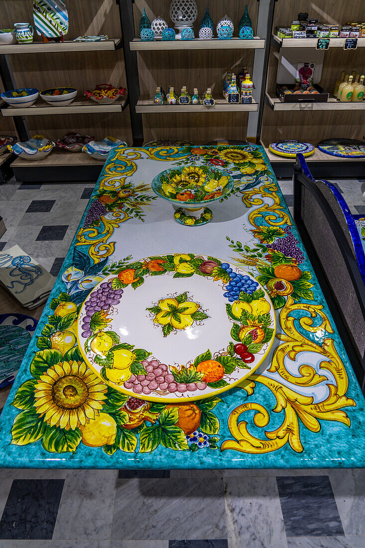 A ceramic table with a lemon & flower motif design in the Campaniadamare shop in Sorrento, Italy.