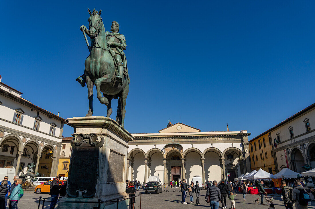 Equestrian statue of Grand Duke Ferdinando I de' Medici. Piazza Santissima Annunciata, Florence, Italy. Behind is the Basilica della Santissima Annunziata.