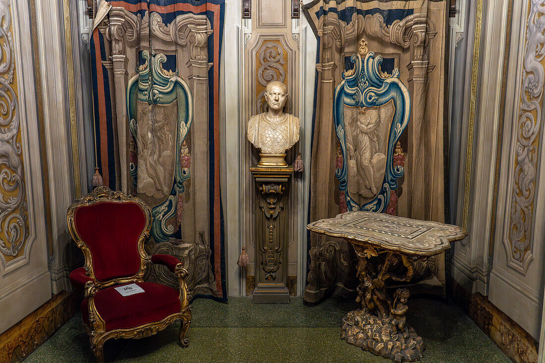 A Florentine mosaic table, Roman bust and Flemish tapestries in the Palazzo Medici Riccardi, Florence, Italy.