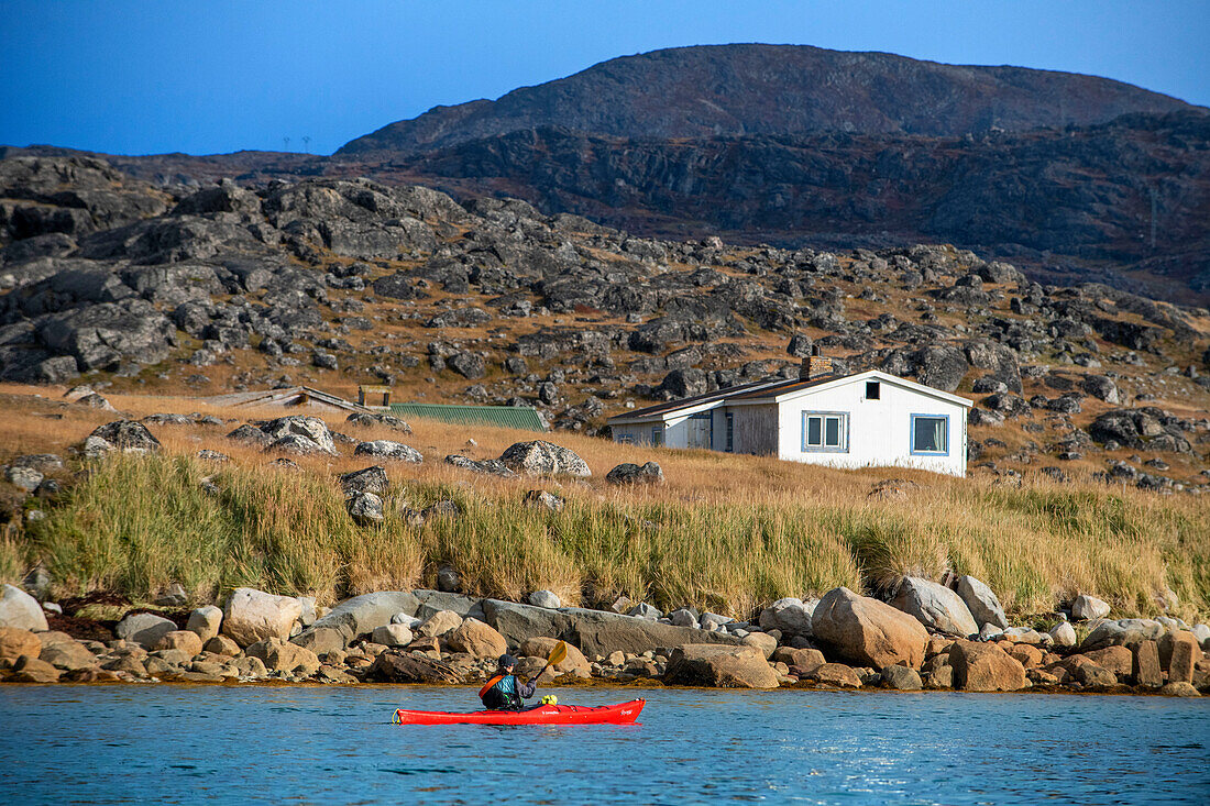 Kayaking nerar the remains of 14thc Hvalsey farmstead Banquet Hall, one of best preserved Norse ruins in the country. Hvalsey, Qaqortoq, Kujalleq, Southern Greenland