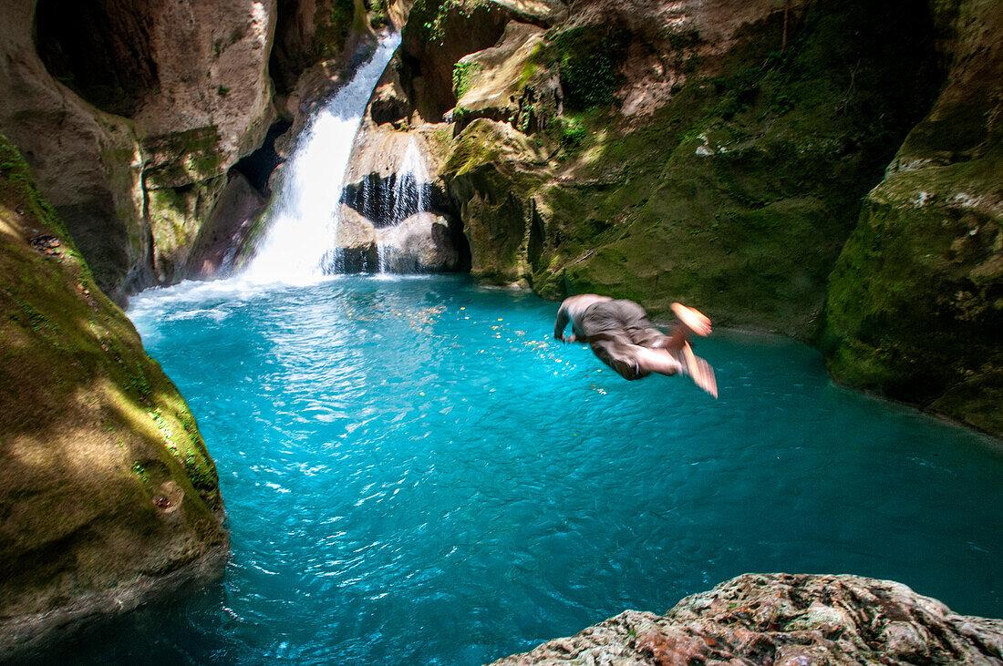 Exploring the cobalt waters of Bassin Bleu waterfall composed of bassin yes, bassin palmiste and bassin clair, Maire de Jacmel, Jacmel, Haiti