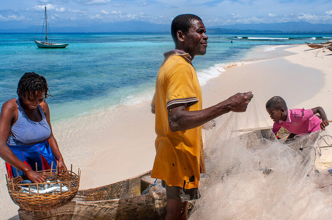 Fishermen with the catch of the day in Cayes-à-L’eau, a fishermen islet located northeast of Caye Grand Gosie, Île-à-Vache, Sud Province, Haiti