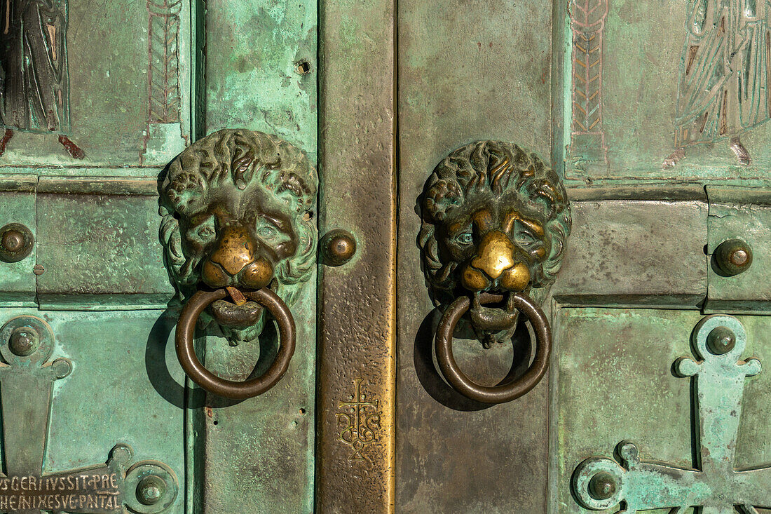 Lion-head door knockers on the bronze doors of the Amalfi Duomo, the Cathedral of St. Andrew, Amalfi, Italy.