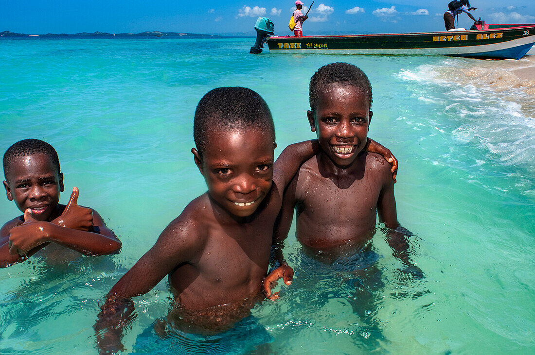 Children playing in the beach on Cayes-à-L’eau, a fishermen islet located northeast of Caye Grand Gosie, Île-à-Vache, Sud Province, Haiti