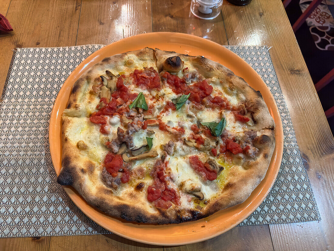 A typical Italian-style pizza in a restaurant / pizzeria in Sorrento, Italy.