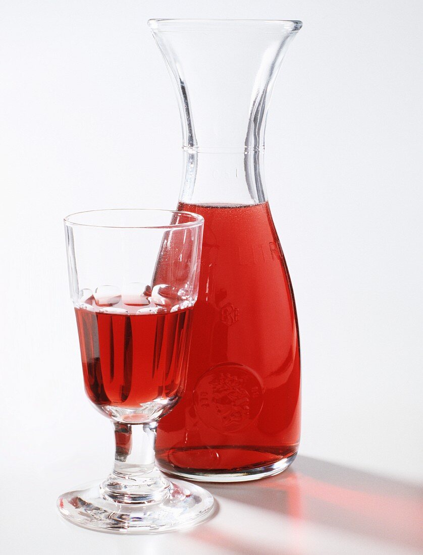 A Glass and Decanter of Red Wine