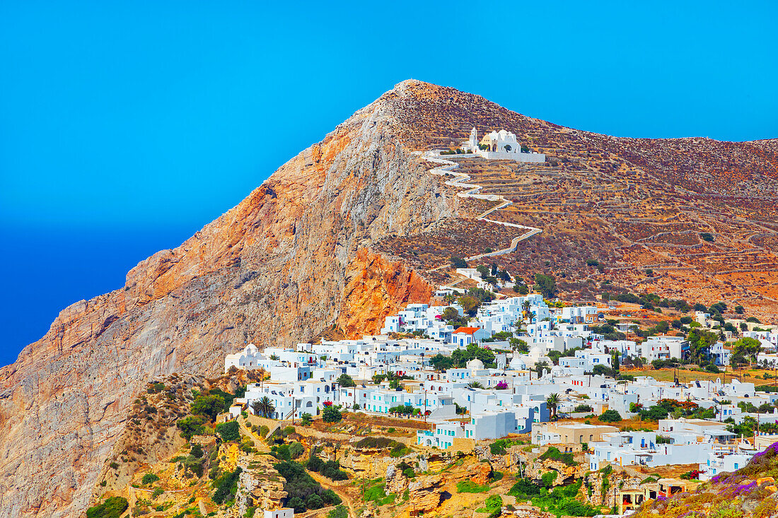 View of Chora village built on a cliff above the sea and Panagia Kimissis church, Chora, Folegandros Island, Cyclades Islands, Greek Islands, Greece, Europe