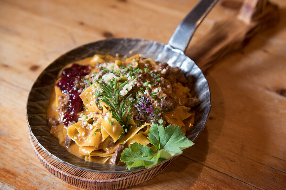 Papardelle served at Knuttenalm mountain restaurant (Malga Knutten), near Ahrntal (Valle Aurina), South Tyrol (Alto Adige), Italy