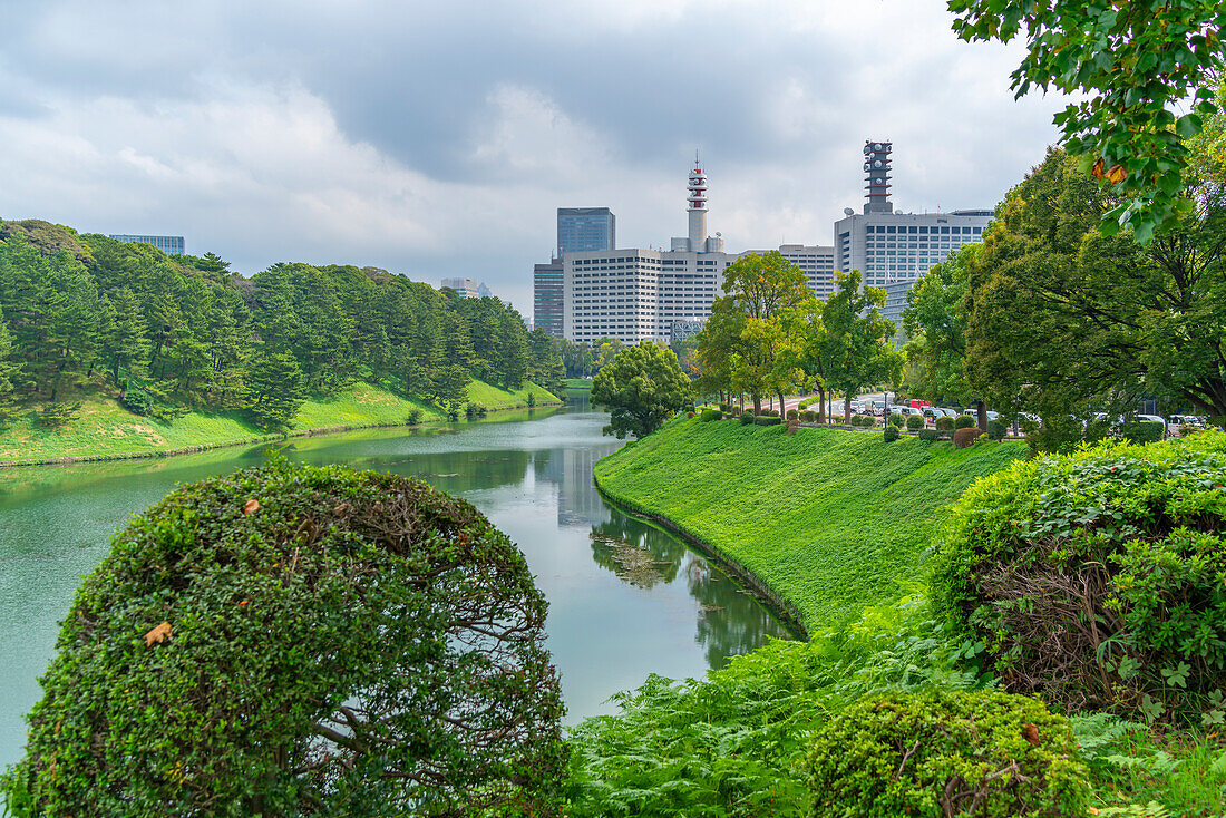 View of city buildings and Sakuradabori Moat of the Imperial Palace, Chiyoda, Tokyo, Honshu, Japan