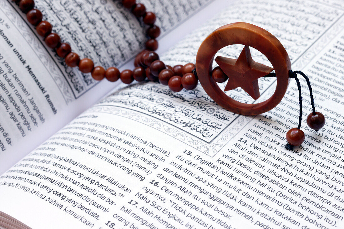 Islamic Holy Book Quran with rosary beads, Ramadan concept, Indonesia