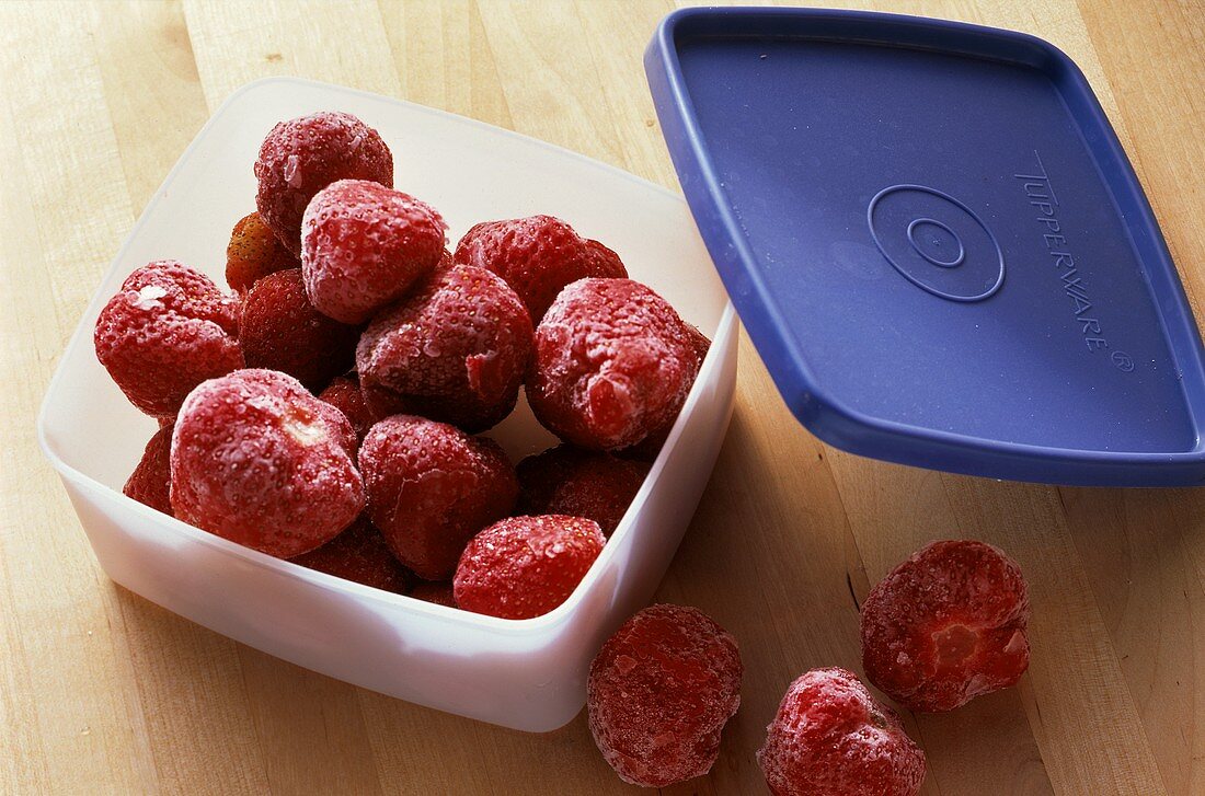 Frozen Strawberries in Plastic Container