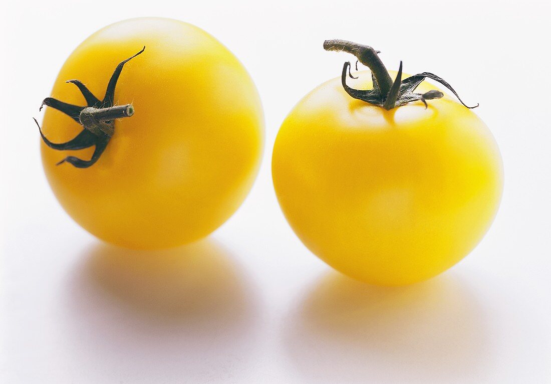 Two yellow tomatoes